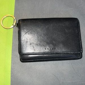 Coach wallet with key ring inside has a zipper change compartment